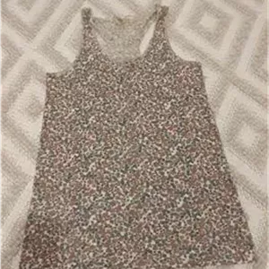 تاپ رکابی نخی زنانه دخترانه گلدار کرم زشکی زارا