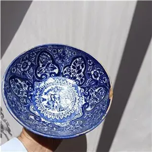یک عدد کاسه آبی قلم قاجاری بند زده شده و لب پردار