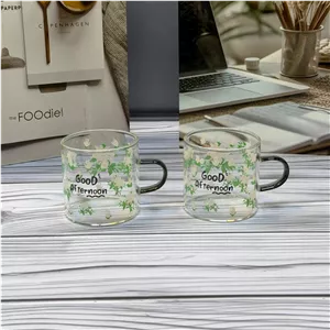 فنجان پیرکس دسته رنگی طرح گل | فنجان شیشه‌ای مناسب چای، قهوه و دمنوش