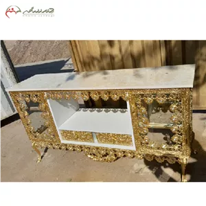 میز تلویزیون آبکاری دارای دو کشو و دو کابین طرح ساده