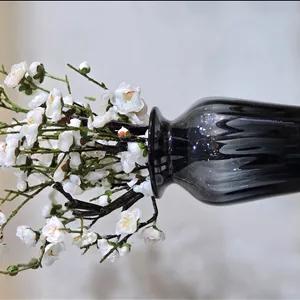 شکوفه ژاپنی به همراه گلدان شیشه ای