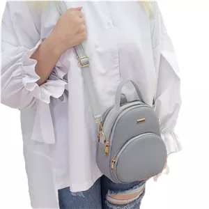 کیف دخترانه سه کاره به صورت دستی،دوشی و کوله جنس وارداتی طوسی