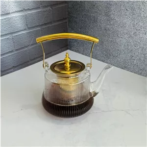 قوری پیرکس شیاردار درب و دسته طلایی 1200 میل