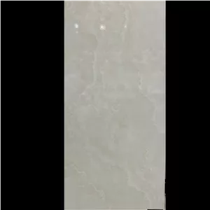 سرامیک 60*120 طرح سنگ کرم اونیکس براق