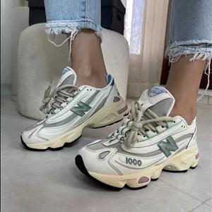 کتونی نیو بالانس 1000 زنانه و مردانه طوسی زیره کرم