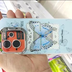 قاب گوشی شیائومی Xiaomi Redmi Note 14 4g طرح پروانه نگین‌دار با محافظ لنز نگینی صورتی