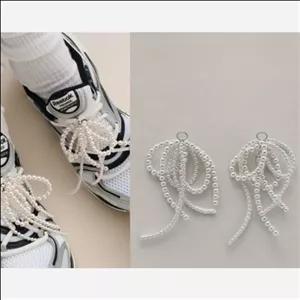 آویز کفش پاپیون مروارید پرکار پینترستی مبلمان نارنجی مدل 526698