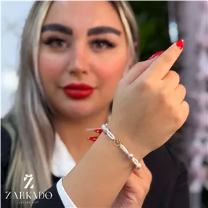 دستبند مروارید پرورشی و میوکی با پلاک طلا طرح گل