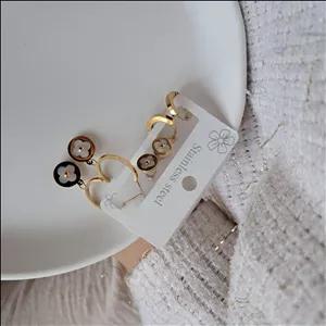 پک گوشواره طلایی ونکیلیف گل سفید سه عددی استیل کد GO1-0035 