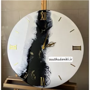 ساعت دیواری رزینی طرح دریا سفید مشکی مبلمونسرا مدل 238951