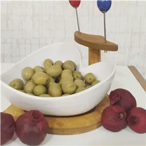 زیتون خوری قلبی جنس چینی پرسلان دارای استند چوبی و دو عدد چنگال رنگی مبلمونسرا مدل 273936 