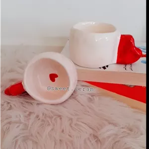 ظروف پذیرایی فنجان قلب دوعددی طرح دفرمه سرامیک دستساز مبلمونسرا مدل 274168