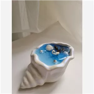 شمع دکوراتیو صدفی باپارافین ژله ای،رایحه ای از دریا مبلمونسرا مدل 287271