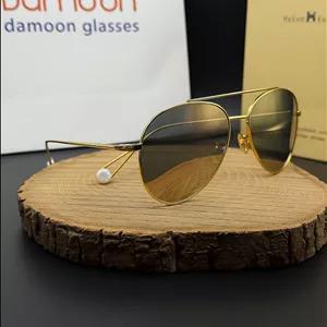 عینک آفتابی زنانه مردانه تیتانیوم طلایی هلن کلر مدل 8603 با عدسی جیوه‌ای