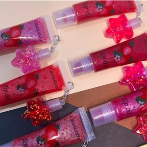 شاین لب  تیوپی همرا با آویز برق لب حرارتی(فروش عمده جین۲۴عددی) 