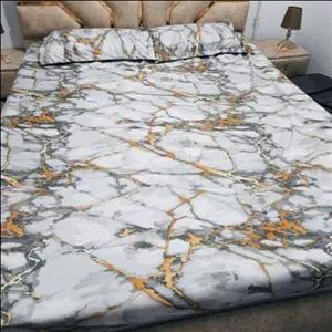 ملافه کشدوزی تشک  تخت دونفره  همراه دوعدد روبالش طرح سنگی خط طلایی