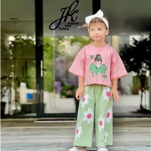 ست تیشرت کراپ و شلوار بگ دخترانه طرح دختر و گل  | سایز ۳۵ تا ۵۵