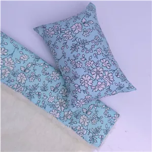 بالشت و پتو آبی گلدار