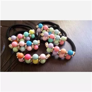 یک عدد کش مو مهره ای رنگارنگ