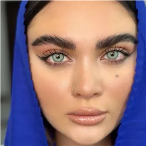 لنز یونیک باربی بلو سبز آبی مرکز عسلی دور دار