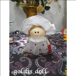 عروسک روسی جاکلیدی دست دوز  ده سانتی طرح عروس .  جاکلیدی عروسک روسی. سفارش عمده هم پذیرفته میشه.  با موی 15 سانتی