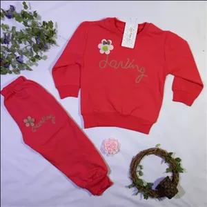 ست بلوز و شلوار دخترانه پاییزه رنگ قرمز باگلدوزی و گل برجسته جنس دورس  یلدایی سایز 32 و 37 کد 1018