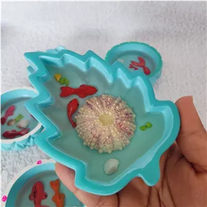 یک عدد حوض ماهی رزینی مدل برگ گود عید رزینی،حوض رزینی با صدف و سنگریزه،حوضچه ماهی سه بعدی رزینی جنس ظرف سنگ مصنوعی رندوم