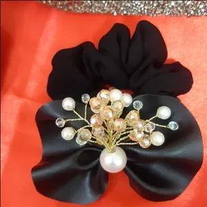 کش موی چرم مجلسی پاپیونی و پر از نگین