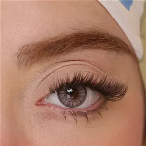 لنز چشم هرا مدل 16 سالانه کد NOB 290 رنگ طوسی عسلی رگه ای دوردار