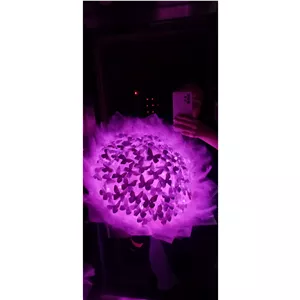 دسته گل پروانه ای 70 شاخه صورتی نگین و تور و پر دار