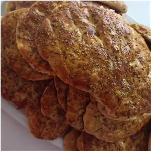 نون محلی سنتی با روکش طلایی و کنجد دار نیم کیلو 150