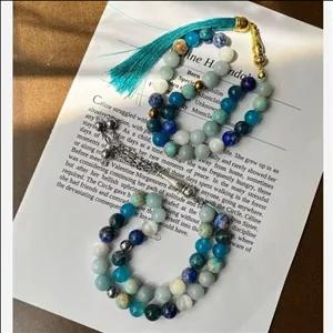 تسبیح هفت سنگ 33 دانه آبی آسمانی از سنگهای اصل طبیعی سایز سنگ 8 لاجورد آپاتیت عقیق آبی فیروزه آمازونیت آکوامارین سلنایت