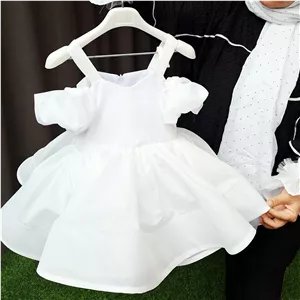 پیراهن مجلسی دخترانه بچگانه سفید مدل لباس عروسبا دامن تور پفی و مچ بند پرنسسی