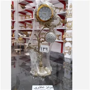 ساعت رومیزی برنجی طرح گل مبلمان نوراس مدل 14139554